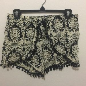 Fun and flirty shorts with cute pom poms!